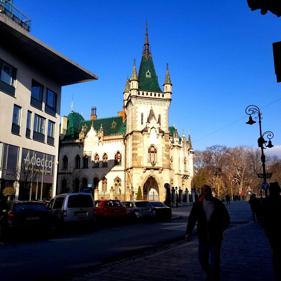 Jakab's Palace in Kosice, Slovakia. It is rather small for a 'palace,' but it is beautiful cream colored building with an emerald green roof and large spires.