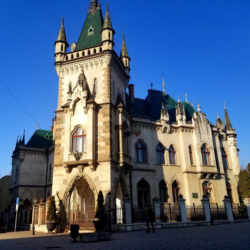 Jakab's Palace in Kosice, Slovakia. It is rather small for a 'palace,' but it is beautiful cream colored building with an emerald green roof and large spires.