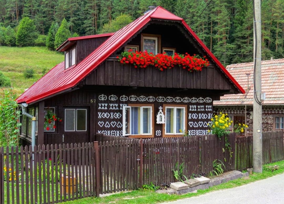 Slovakia painted building with red roof and flowers