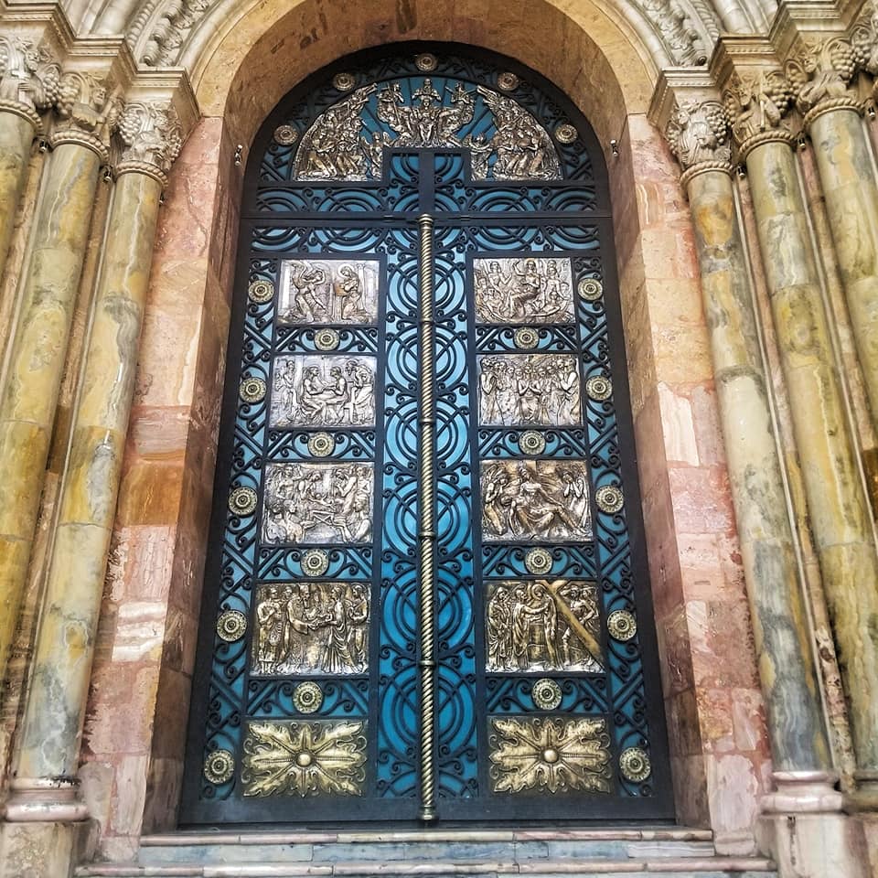 Large turquoise door in Cuenca, Ecuador.