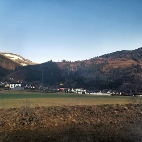 Alpine forests covering mountains on the overnight train from Rome to Vienna