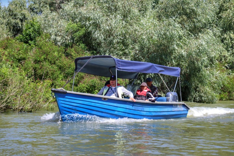 Blue covered boat on an excursion at the Danube Delta, Romania