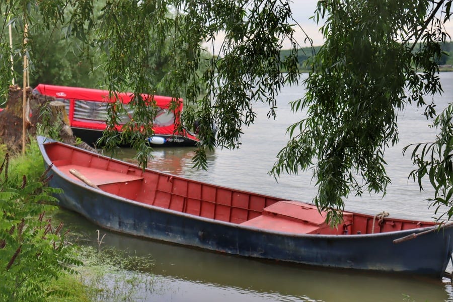 Old boats on the shore of the Danube River at its Delta in Romania