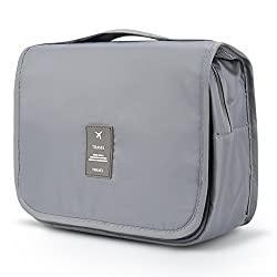 Light gray toiletry holder with multiple compartments, folds down to be hangable, and has mesh inserts to keep things dry.