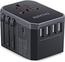 Black universal adapter with 4 USB ports compatible in every country.  