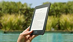 Kindle Paperwhite shown in black.  Waterproof and blue light minimizing, this is a great gift for any travel lover.