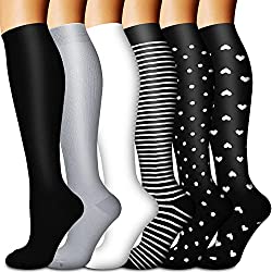 Five different compression sock styles shown, in shades of black and grey.