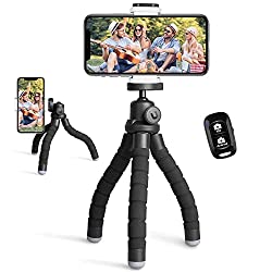 Adjustable cell phone tripod, complete with Bluetooth remote.  A definite travel essential if you are flying solo.