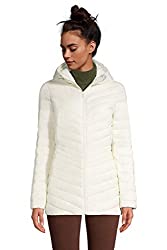 Woman modeling a cream-colored packable down jacket, a perfect gift for travel lovers who like to travel to colder destinations while still packing light.